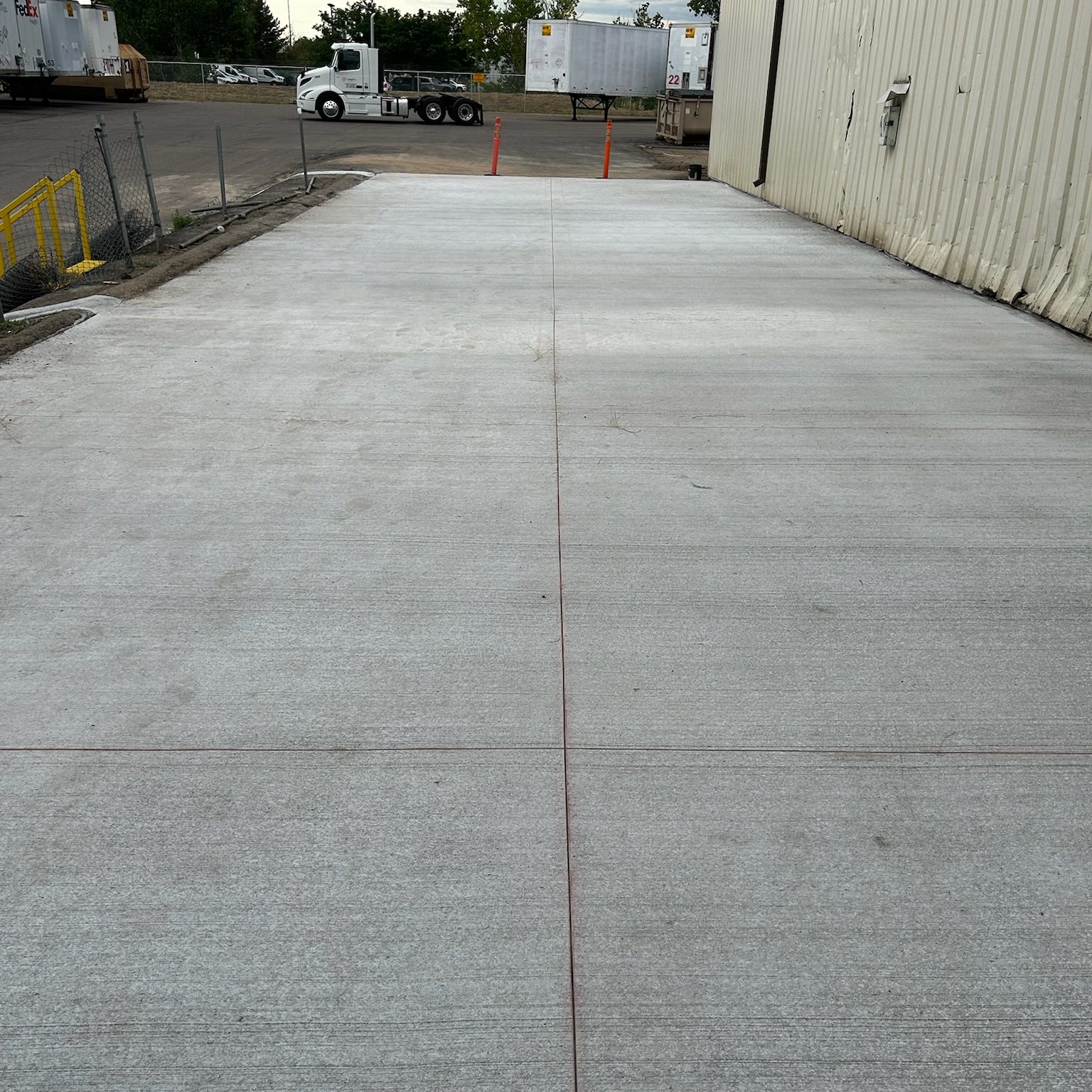 paved driveway between grass lawn