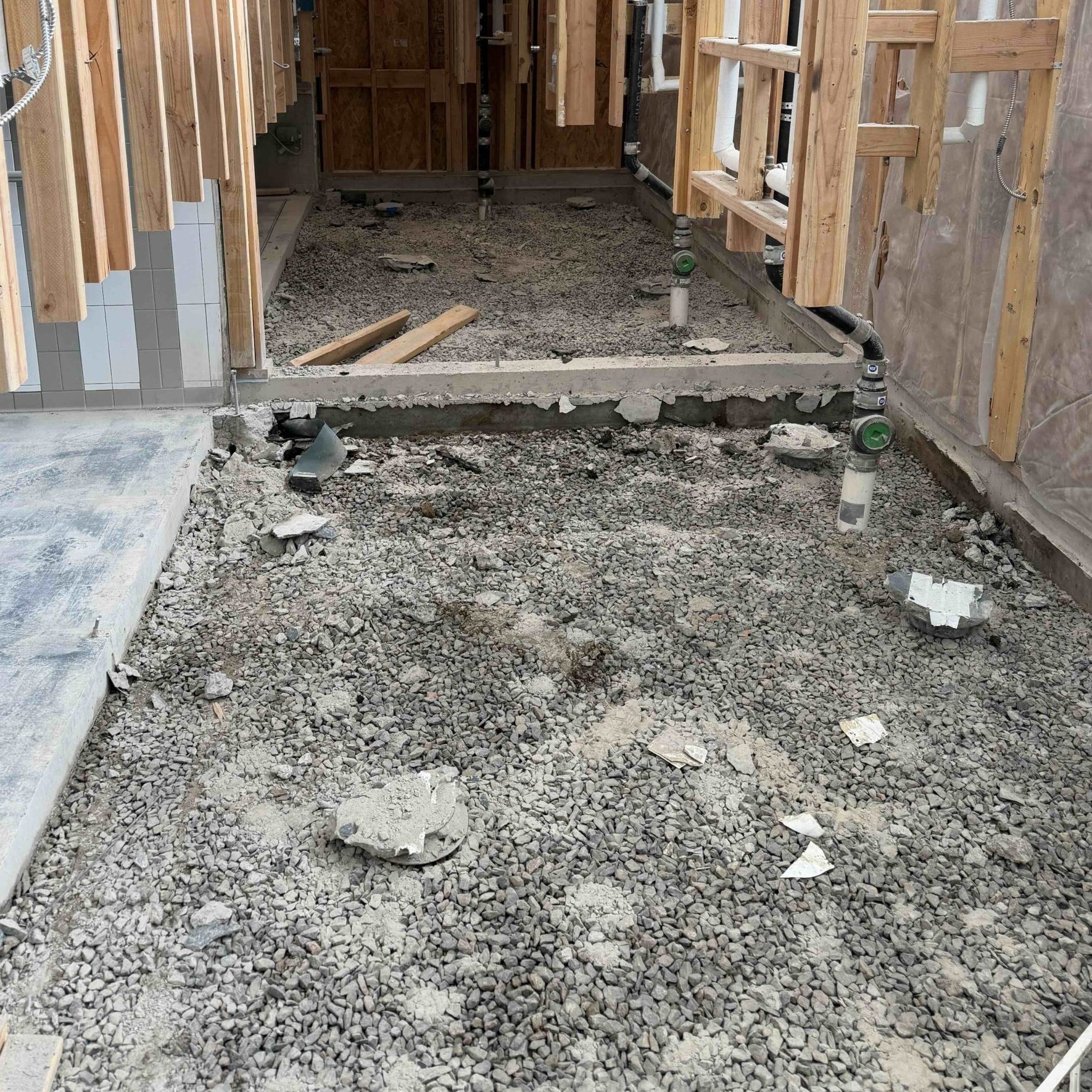 paved driveway between grass lawn